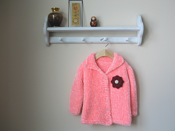 hand knit sweater with crochet flower applique