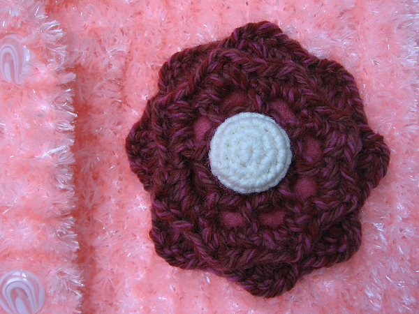 hand knit sweater with crochet flower applique